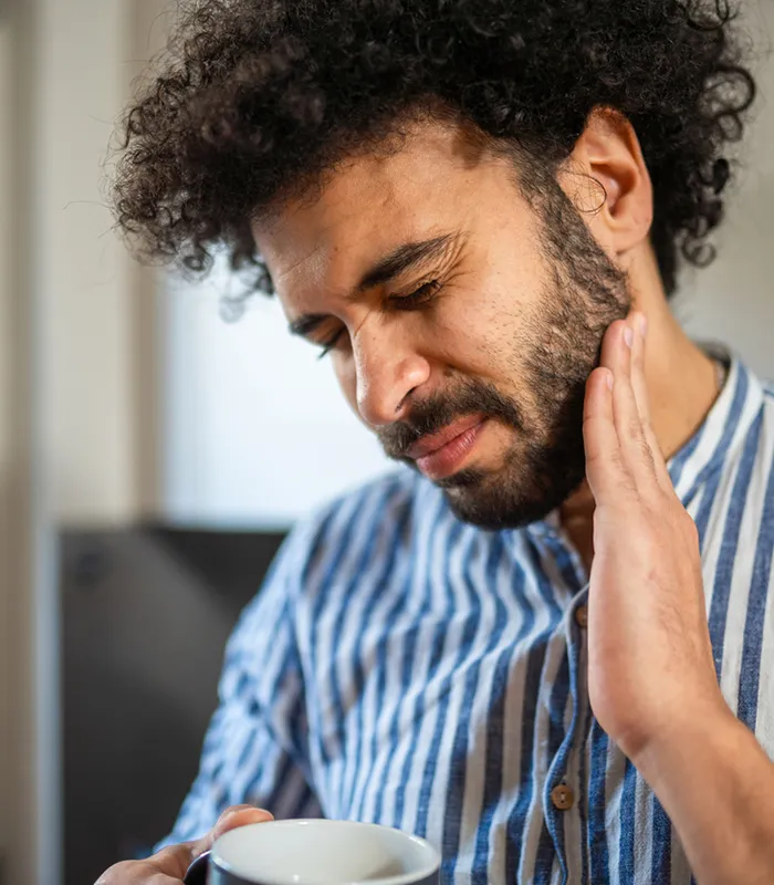 Man With Tooth Pain Holding Jaw