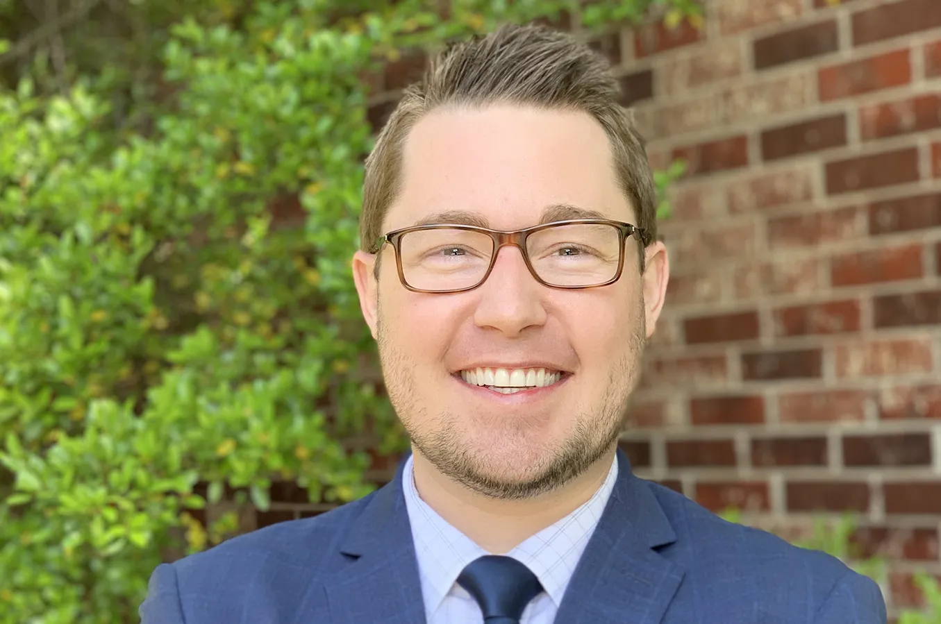 OKC Dentist Dr. Sigler Posing Outside Downtown Dental Office